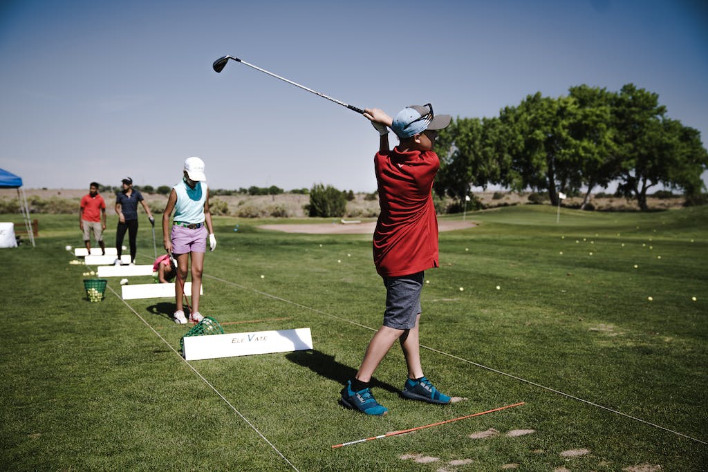 Person Swinging Golf Club on Field How can You Tell If Someone Is Good at Golf?