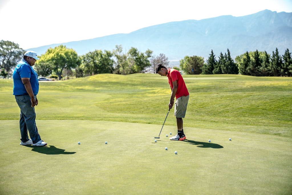 Two Men Playing Golfs